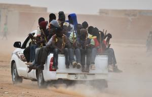 A pick-up truck carrying migrants rides through Agadez&nbsp;&hellip;