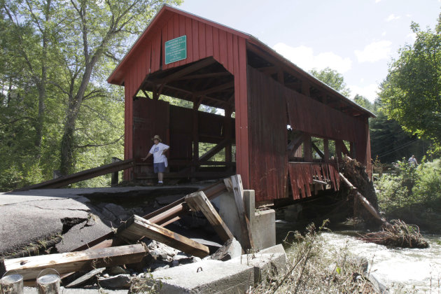 A damaged historic covered bridge spans Cox Brook in Northfield, Vt., Monday, Aug. 29, 2011, the day after Tropical Storm Irene dumped heavy rainfall across the region, causing flash floods. (AP Photo