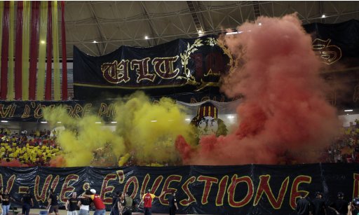 Fans of Tunisia's Esperance Sportive de Tunis celebrate after their team scored a goal against Tunisia's Etoile Sportive du Sahel during their African Champions League soccer match at the Rades stadium in Tunis