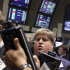 FILE - In this Aug. 16, 2011 file photo, traders work on the floor of the New York Stock Exchange. European stocks failed to keep up with gains in Asia on Thursday, Sept. 1, 2011, as downbeat reports on the manufacturing sector darkened investors' moods. (AP Photo/Richard Drew, File)