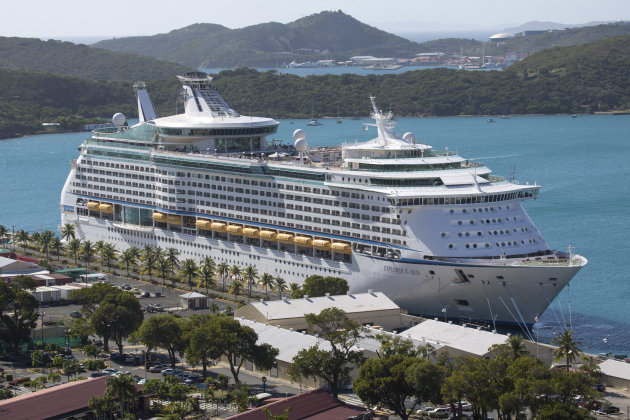 The Royal Caribbean International's Explorer of the Seas is docked at Charlotte Amalie Harbor in St. Thomas, U. S. Virgin Islands, Sunday, Jan. 26, 2014. U.S. health officials have boarded the cruise liner to investigate an illness outbreak that has stricken at least 300 people with gastrointestinal symptoms including vomiting and diarrhea. (AP Photo/Thomas Layer)