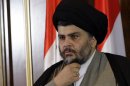 Shiite cleric Muqtada al-Sadr looks on during a press conference in Irbil, a city in the Kurdish controlled north 217 miles (350 kilometers) north of Baghdad, Iraq, Thursday, April 26, 2012. A hardline Shiite cleric is meeting with the president of Iraq's Kurdish region to try to end a political crisis that has deadlocked the nation's government. Anti-American cleric Muqtada al-Sadr offered plans Thursday to resolve the impasse through political inclusiveness.(AP Photo/Khalid Mohammed)