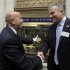 Former New York Stock Exchange Chairman Richard Grasso, left, is greeted by current NYSE CEO Duncan Niederauer as Grasso arrives at the exchange Friday, Sept. 9, 2011. Grasso is participating the exchange's Sept. 11 commemoration. (AP Photo/Richard Drew)