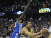 Denver Nuggets guard Andre Miller, right, drives past Golden State Warriors forward Draymond Green, left, for the game-winning basket in the second half of Game 1 in the first round of the NBA basketball playoffs on Saturday, April 20, 2013, in Denver. (AP Photo/Chris Schneider)
