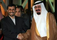 Saudi King Abdullah bin Abdul Aziz al-Saud (right) greets Iranian President Mahmoud Ahmadinejad during a 2007 visit to Riyadh. The Saudi monarch has invited Ahmadinejad for an extraordinary summit of Muslim leaders to be held this month in the holy city of Mecca, according to the SPA news agency. (AFP Photo/Hassan Ammar)