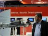 A visitor walks past a stand for Italian defence group Finmeccanica during the IDEX at the Abu Dhabi National Exhibition Centre