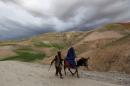 Afghan family travels with a donkey in the Argo district in Badakhshan province