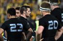 New Zealand All Blacks skipper Richie McCaw (C) reacts following team's defeat against Australia in the Bledisloe Cup Test match as part of the Rugby Championship in Sydney on August 8, 2015
