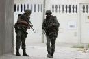 Tunisian soldiers patrol a residence in Oued Ellil, west of Tunis