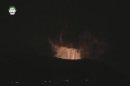 Still image taken from video shows a cloud of smoke in the sky after an explosion at what Syrian state television reported was a military research centre in Damascus