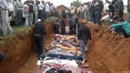 A handout from the Local coordination Committees in Syria (LCC) purportedly shows Syrians inspecting a mass grave in Taftnaz on April 6. Carla del Ponte -- a member of a UN commission investigating rights abuses in Syria -- said war crimes and crimes against humanity are happening in war-torn Syria