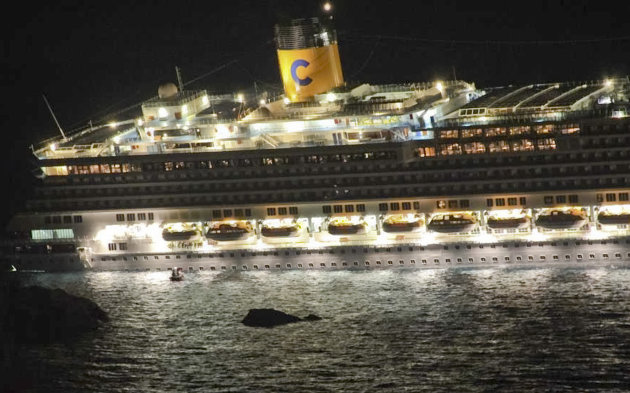 The luxury cruise ship Costa Concordia leans after it ran aground off the coast of the Isola del Giglio island, Italy, gashing open the hull and forcing some 4,200 people aboard to evacuate aboard lif