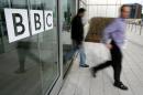 People leave the BBC building, in the corporation's West London headquarters, on March 21, 2005