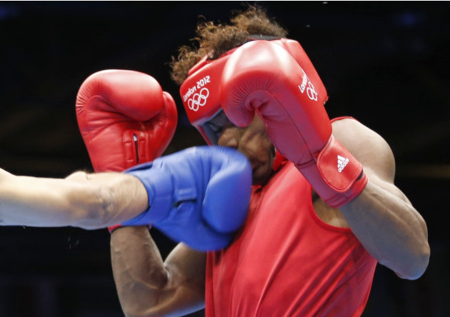 Seychelles' Andrique Allisop (red) fights against India's Jai Bhagwan in the men's light (60kg) Round of 32  boxing match at ExCeL venue during the London 2012 Olympic Games