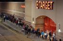Shoppers head into Target just after thei doors opened at midnight on Black Friday, Nov. 28, 2014, in South Portland, Maine. (AP Photo/Robert F. Bukaty)