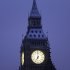 Snow covers the roof of the Big Ben clock tower above the Houses of Parliament in central London