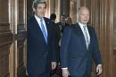 Britain's Foreign Secretary William Hague walks with U.S. Secretary of State John Kerry at the Foreign Office in London