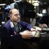 Brian Bartsch works on last minute trades on the floor of the New York Stock Exchange, just before the closing bell