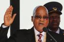 A picture taken in Pretoria on May 24, 2014 shows South African President Jacob Zuma taking the oath during his inauguration ceremony