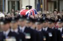 Prison Officers carry the coffin of their murdered colleague David Black to Molesworth Presbyterian Church in Cookstown, Northern Ireland, Tuesday, Nov. 6, 2012. The father of two was shot dead by suspected paramilitary Irish Republican dissidents in County Armagh on Thursday as he drove to work at Maghaberry Prison. (AP Photo/Peter Morrison