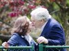 Conrad Black, right, kisses his wife Barbra Amiel Black as he arrives at his Bridle Path residence in Toronto on Friday, May 4, 2012. Black was convicted of fraud and obstruction of justice charges in 2007 for his business dealings while at the helm of newspaper giant Hollinger. (AP Photo/The Canadian Press, Nathan Denette)