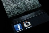A photo illustration shows the applications Facebook and Instagram on the screen of an iPhone in Zagreb April 9, 2012. REUTERS/Antonio Bronic