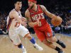 New Jersey Nets' Deron Williams, right, drives to the basket as New York Knicks' Jeremy Lin defends during the third quarter of an NBA basketball game Monday, Feb. 20, 2012, at Madison Square Garden in New York. The Nets defeated the Knicks 100-92. (AP Photo/Bill Kostroun)
