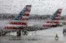 Planes parked at the terminal Reagan National Airport in Washington on a rainy travel day