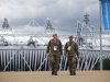 British military personnel walk away from the Olympic Stadium as preparations continue for the 2012 Summer Olympics, Sunday, July 15, 2012, in London. (AP Photo/Jae Hong)