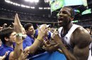 Kansas forward Thomas Robinson celebrates with fans after their 64-62 win over Ohio State during an NCAA Final Four semifinal college basketball tournament game Saturday, March 31, 2012, in New Orleans. (AP Photo/David J. Phillip) 0