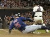 Cleveland Indians' Jim Thome (25) slides in with a run as Minnesota Twins catcher Drew Butera (41) blocks the ball back into the field during the fourth inning of a baseball game on Friday, Sept. 16, 2011, in Minneapolis. (AP Photo/Tom Olmscheid)
