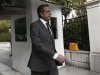 Greek PM Samaras walks towards his office in Athens shortly after arriving in Greece