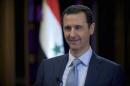 Syria's President Bashar al-Assad is seen during the filming of an interview with the BBC, in Damascus