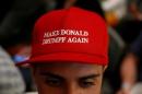 An attendee wears a "Make Donald Drumpf Again" hat during the "Politicon" convention in Pasadena, California