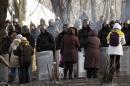 Ukranian women talk with riot police at the site of clashes in Kiev