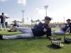 New York Yankees shortstop Derek Jeter stretches before a spring training baseball game against the Philadelphia Phillies in Clearwater, Fla., Tuesday, March 19, 2013.  Jeter says he was removed from Tuesday's lineup for "precautionary" reasons because his surgically repaired left ankle feels "stiff."(AP Photo/Kathy Willens)