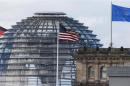 The flag on the U.S. embassy is pictured next to the Reichstag building, seat of the German lower house of parliament Bundestag, in Berlin