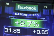 FILE- This Wednesday, May 23, 2012, file photo, shows the pre-market price for Facebook at the Nasdaq MarketSite in New York. The Nasdaq stock exchange said Wednesday that it plans to hand out $40 million in cash and credit to reimburse investment firms that got ensnared by technical problems with trading Facebook stock. (AP Photo/Mark Lennihan, File)