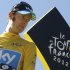 Bradley Wiggins, winner of the 2012 Tour de France cycling race, looks back on the podium in Paris, France, Sunday July 22, 2012. (AP Photo/Laurent Cipriani)