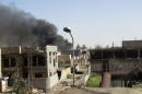 Smoke rises during clashes between Iraqi security forces and militants of the Islamic State, formerly known as the Islamic State in Iraq and the Levant (ISIL) in Ramadi