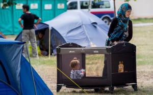 A refugee mother with her baby in the grounds of Austria&#39;s&nbsp;&hellip;