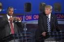 Republican presidential candidate, retired neurosurgeon Ben Carson, left, speaks as Donald Trump looks on during the CNN Republican presidential debate at the Ronald Reagan Presidential Library and Museum on Wednesday, Sept. 16, 2015, in Simi Valley, Calif. (AP Photo/Mark J. Terrill)
