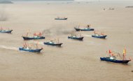 Chinese fishing boats set off to fish near the disputed Diaoyu Islands, also known as the Senkaku Islands in Japan, from Shipu fishing port in Xiangshan county, east China's Zhejiang province, on September 16. Japan and China are at loggerheads over the archipelago in the East China Sea currently administered by Tokyo