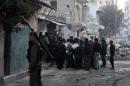 Opposition fighters prepare to storm the headquarters of the jihadist Islamic State of Iraq and the Levant (ISIL) fighters in the Bab al-Neirab neighbourhood of the northern Syrian city of Aleppo on January 7, 2014