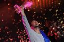 Sweden's Mans Zelmerlow holds the trophy after winning the Eurovision Song Contest final on May 23, 2015 in Vienna