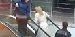 Woman is determined to walk up escalator (BCN)