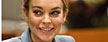Lindsay Lohan smiles in court during a progress report on her probation for theft charges at Los Angeles Superior Court Thursday, March 29, 2012. (AP Photo/Joe Klamar, Pool)