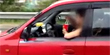 Woman drives while eating with chopsticks (Butterfinger)