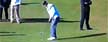 Michael Phelps prepares to putt (Y! Sports screengrab)