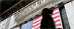 Morning commuters walk past the New York Stock Exchange, October 24, 2012. REUTERS/Brendan McDermid)